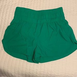 Green athletic shorts